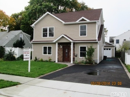 Colonial With Brand New 2nd Floor. Brand New Kit. With Granite Counter,  Custom Kit. Cabinets And Ss Appl. Three Bedrooms On 2nd Floor With Two Brand New Bathrooms. Master Br. Has High Ceiling.Newly Built Det. Gar. With Extended Driveway. New Roof & Siding. New Doors And Windows. Hardwood Floor. New Boiler & Hot Water Heater. **Must See**.