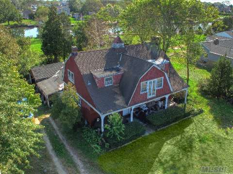 Beautiful One Acre Blue Harbour Waterfront. Over 148' Along The Wide And Deep Foster Creek. Two Cut-In Boat Slips. House Was Built In 1892 By E. W. Howell And Was The Carriage House For The E. Dodd Estate. It Was Converted To A Home In The 1920'S. Fabulous Opportunity To Build Your Dream Waterfront Estate !