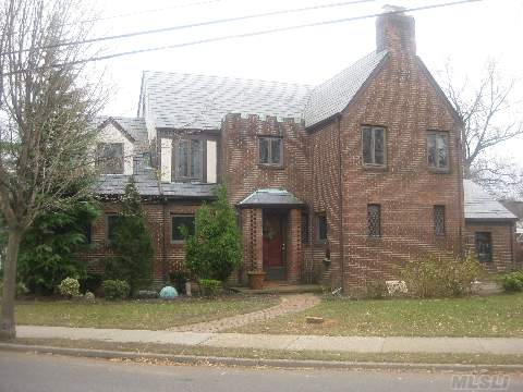 Tudor W/ 4 Lots.Updated Kit W/Ss Appliances&Marble Counters.Fdr Has Built-In Leaded China Closets.Lr W/Fpl,Cherry Woodwork&Cabinetry& 1/2 Bth.Den Has Entry For Possible Prof Office.4 Bdrms And 2 Full Bths.Unfin Bsmt W/New Windows.Home Has Vt Slate Roof,Andersen Windows,Pegged Oak Floors&Cedar Closets. Near Lirr, Shops&Schools.Tax Grievance Of 30.8% Dn. For 2013$13,173