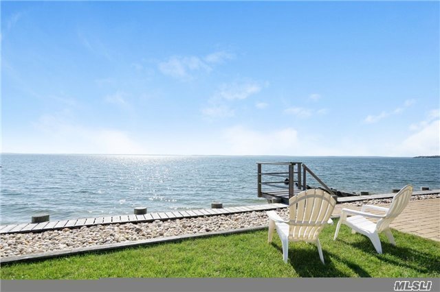 Exceptional Waterfront Cottage With Expansive Bay Views And Steps To Private Sandy Beach,  Encompassing An Open Floor Plan Throughout With Waterviews From Every Room. This Immaculate, Updated 3 Bedroom, 2 1/2 Bath Home, Including Bonus Loft, Outdoor Bath House And 2 Car Garage Has It All! Moor Your Boat Out Front Or Full Service Marina Steps Away. A True Gem!