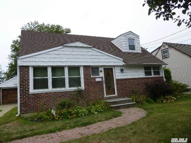 Nice 4 Bedroom Cape. Large Dining Room, Newer Kitchen And Bathrooms. Finished Basement Detached One Car Garage.