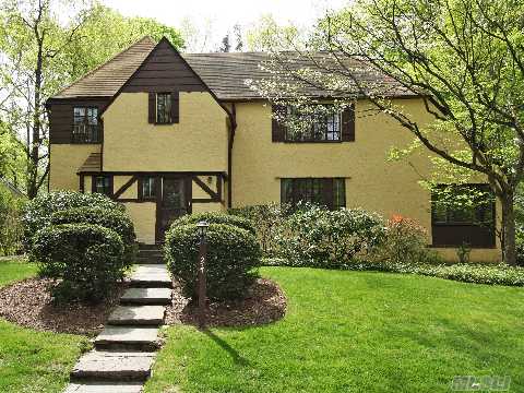 Mid Block Location In Thomaston. Beautiful Tudor With 5 Br, 3.5 Bth, Large Lr, Formal Dining Room, & Eik With Breakfast Area. Features Fabulous Wood Floors That Look Like New. Bright & Cheery, Great Sunroom, 2 Car Garage & Basement. Tree Lined Street In A Convenient Area To Town. Approximately .4 Miles To Lirr. Easy Access To North Shore University Hospital & Li Jewish.