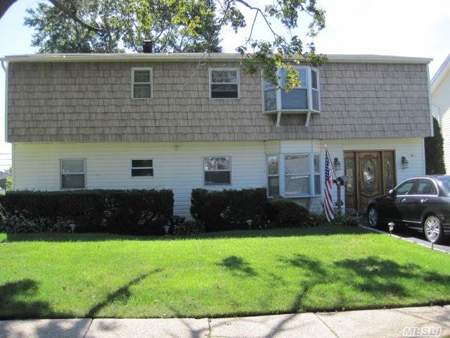 This Is A Wonderful Mother/Daughter (Permits Required) With Generous Room Size. Both Floors Have A Banquet Size Formal Dining Room Besides An Eat In Kitchen. There Are A Total Of Five Bedrooms For A Large Or Extended Family Besides 2 Dens, Hardwood Floors, Front Yard Igs All In Plainedge Sd18. House Located On A Dead End Block.