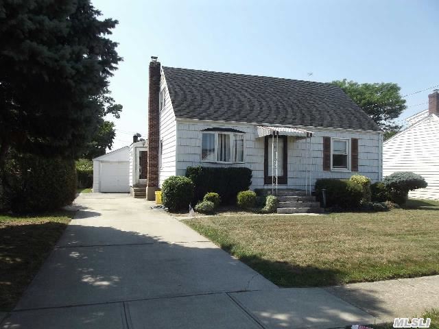 Great House!  Mid-Block Location. Nice Dining Room Extension With Sliders To Deck. Updates Include Bathroom,  Roof,  Carpeting,  Brand New Gas Stove And Refrigerator. Finished Basement. Detached Garage. There Is Gas In The Home So Oil Burner Can Easily Be Converted.  Close To Shopping And Train Station.