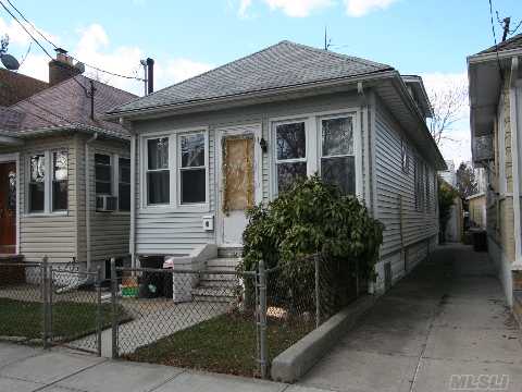 Detached One Family Home Features Two Bedrooms, Two Baths, Living Room, Dining Room, Kitchen, And A Full Basement That Is Partially Finished. Nice Block.