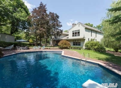 A Circular Driveway Leads To This Spectacular Center Hall Colonial On A Private Cul-De-Sac With Lushly Landscaped Gardens And In-Ground Swimming Pool. Grand Entry Foyer,  Formal Living Room W/Dual Fireplace,  Banquet Size Dining Room,  Den + Family Room,  Huge Eat-In-Kitchen And Screened In Porch .  The Home Offers 6 Large Bedrooms + Maids And 4.5 Baths,  Plus A Home Office.