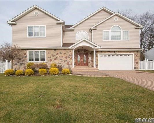 Beautiful Colonial Featuring Stainless Chefs Kitchen. Den With Fireplace Huge Master Bedroom Suite 3 Additional Large Bedrooms . Very Large Finished Basement With French Doors And Heated Floors.