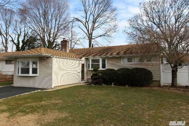 This Beautifully Landscaped Massapequa Park Expanded Ranch Located In The Heart Of The Village Featuring 3 Bedrooms (1 Currently Being Used As Additional Dining Space),  1 Full Bath,  Fdr,  Living Room W/Fireplace,  Kitchen And Large Expanded Family Room. The Full Basement W/High Ceilings,  Washer/Dryer And Utilities.