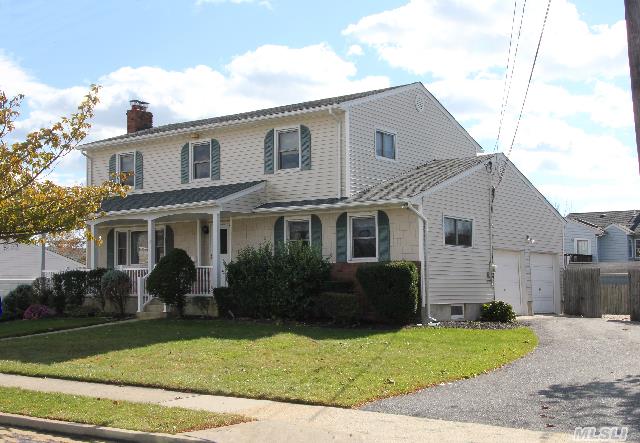 4 Bedroom,  3 Full Bath Colonial In Massapequa School District. Beautiful Hardwood Floors Under All Carpet,  Big Eat-In Kitchen.  New Roof And New Boiler,  Central Air,  2 Car Garage,  Full Basement W/Outside Entrance.   Clean And Well Maintained,  The Home Never Had Smokers Or Pets... Ever!  Needs A Little Cosmetic Updating. Great Opportunity To Make This Your Dream Home.