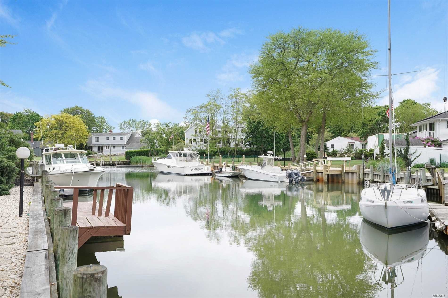Price Reduced! Solid, Spacious Waterfront Home With Deep Water Dock! Vaulted Ceiling. Open Floor Plan. Central Air Conditioning.  Bulkhead. Floating Dock. 2 Minutes To Bay. Quiet Cul De Sac. Community Bay Beach. 3 Blocks To Winery. 3 Bedrooms/3 Full Baths.