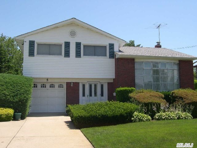 No Water Here! Sandy Blew Right By! An Opportunity To Live In The Shores-This Oversized Split Features New Roof-Newer Windows-Heated Garage-Built In Bar In Basement,  New Furnace,  Just Bring Your Dreams!!!