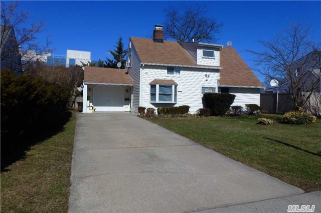 Updated 4 Br 2 Bth Expanded Ranch In Quiet Convenient Location. New Siding(2009), Full Bath, Electric, Security Lighting,  Windows(2004), Insulation On Outside Walls, Double Wall Oil Tank, Oversized Garage, Landscaped. Very Close To Lirr, Shopping, Schools. Private Backyard.