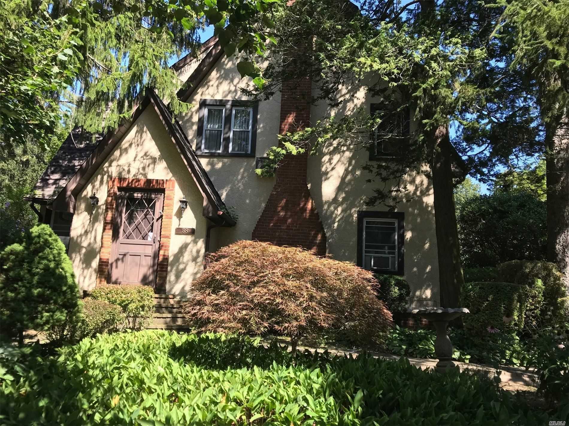 Charm & grace enhance the beautiful bones of this 3 BR Tudor. Large LR w/fireplace, spacious Eat-in-Kitchen and Formal Dining Room. Master Suite with dressing area and lots of closet space. Landscaped grounds. North Shore Schools, beach privileges. Don't miss this one!