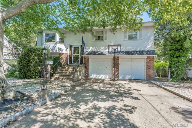 Move-In Condition 4 Bdrm 2 Bath Wide-Line Hi-Ranch W/2 Car Garage. Eat-In Kitchen, Fdr, Living Room. Hardwood Floors, Cac, 200 Amp Electric, New Hot Water Heater, 2 Zone Heat. Great Block! Won&rsquo;t Last!
