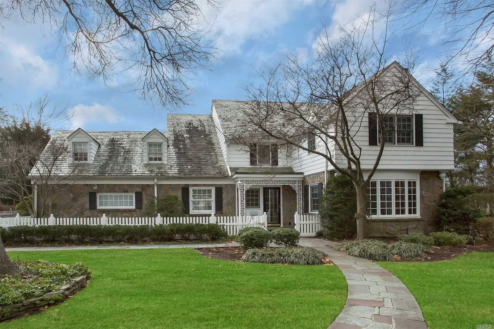 Beautifully Renovated And Expanded Fieldstone And Cedar Shake Colonial Set In Flower Hill Featuring 4 Bedrooms And 3.5 Baths. Entry Foyer Leads To Living Room With Fireplace, Formal Dining Room, Library, Eat-In Kitchen Adjoining Family Room With Vaulted Ceiling, Office And Powder Room. This Classic Home Offers Original Design, And Close Proximity To Town, Train And Schools