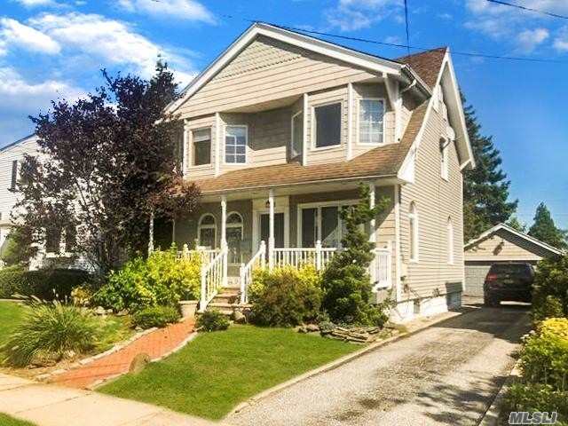 THIS UNIQUE COLONIAL FEATURES A MASTER SUITE, 2 ADDITIONAL BEDROOMS, 2 FULL BATHS, HARDWOOD FLOORS, GRANITE COUNTER TOPS, LIVING ROOM W/ WOOD BURNING FIREPLACE, CAC, 200 ELECTRICAL AMP, LARGE FORMAL DINING ROOM, 2 CAR GARAGE, AND FULL FINISHED BASEMENT W/ OSE! LOCATED ON THE LYNBROOK BORDER! GREAT LOCATION, CLOSE TO LIRR AND TRANSPORTATION! A MUST SEE! WONT LAST!!!