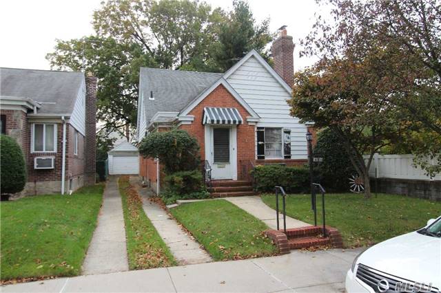 Detached Brick Cape On 35 X 137 Lot Zoned R2A. Building Size 22 X 43. Gas Heat. Detached One Car Garage, Needs Updating.