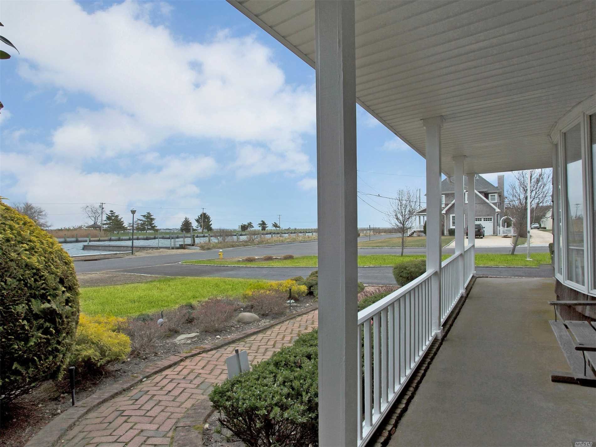 Open and sun filled WATERFRONT farm ranch w/bayviews! Walk out your front door to your boat! Cathedral ceilings, wd flrs, large EIK w/Viking, Subzero, skylights. 2 MSTR BDRMS(1st & 2nd flr), room for 4th bdrm, New baths, Gas heat, CAC, wd deck with wonderful private yard. Over 3400 Sq Ft Meticulously maintained - just in time for summer bbq&rsquo;s by the beach! Flood Ins 842$/year. Village amenities -docking, beach, tennis, parks, snow removal, code enforcement.