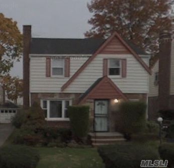 Beautiful Tudor, Fully Renovated And Full-Finished Basement    Covered Rear Screen Porch     Hardwood Floors