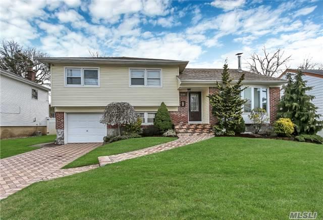 Mint 3 Bdrm 2 1/2 Bath Updated Mid-Block Split Close To The Harbor! Entry Foyer, Living Rm W/Woodburning Stove, Formal Dining Room, Granite/Stainless Eik, Updated Roof, Windows, 200 Amp Electric, Pella Doors, 5 Year Walk-Way, Driveway. Beautifully Landscaped. Won&rsquo;t Last!!
