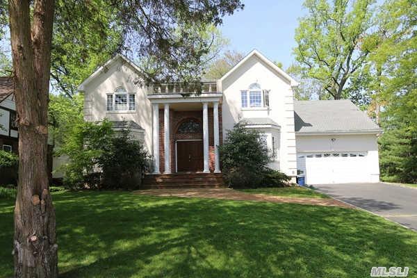 House Sits Beautifully In Middle Of Block.  It Includes,  Four Bedrooms,  2.5Baths,  Large Kitchen,  Den,  Lr,  Dr. Also Has A Finished Basement.