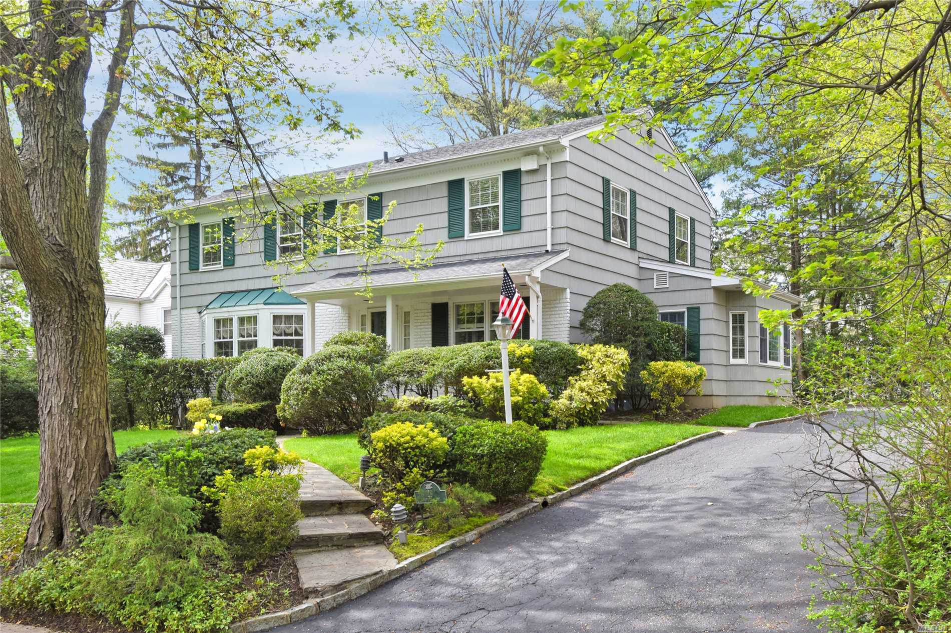 Welcome To This Sunny, South Facing Colonial In The Desirable Village of Russell Gardens W/ Private Community Pool/Tennis. Situated On A Beautiful Tree Lined St, Mins To Town, LIRR And Bus. Lg Entry Leads To LR W/Fpl, Huge Den With Cathedral Ceiling And Radiant Heated Floors Overlooking Private Yard. Renov EIK, DR, 1/2 Bth, Laundry On Main Level And 2 Car Garage. 2nd Floor Master Bdrm W/Full Bth And Walk-In Closets, 3 Add Bdrms W/Full Bth. Great Neck South Schools And Park District Amenities.