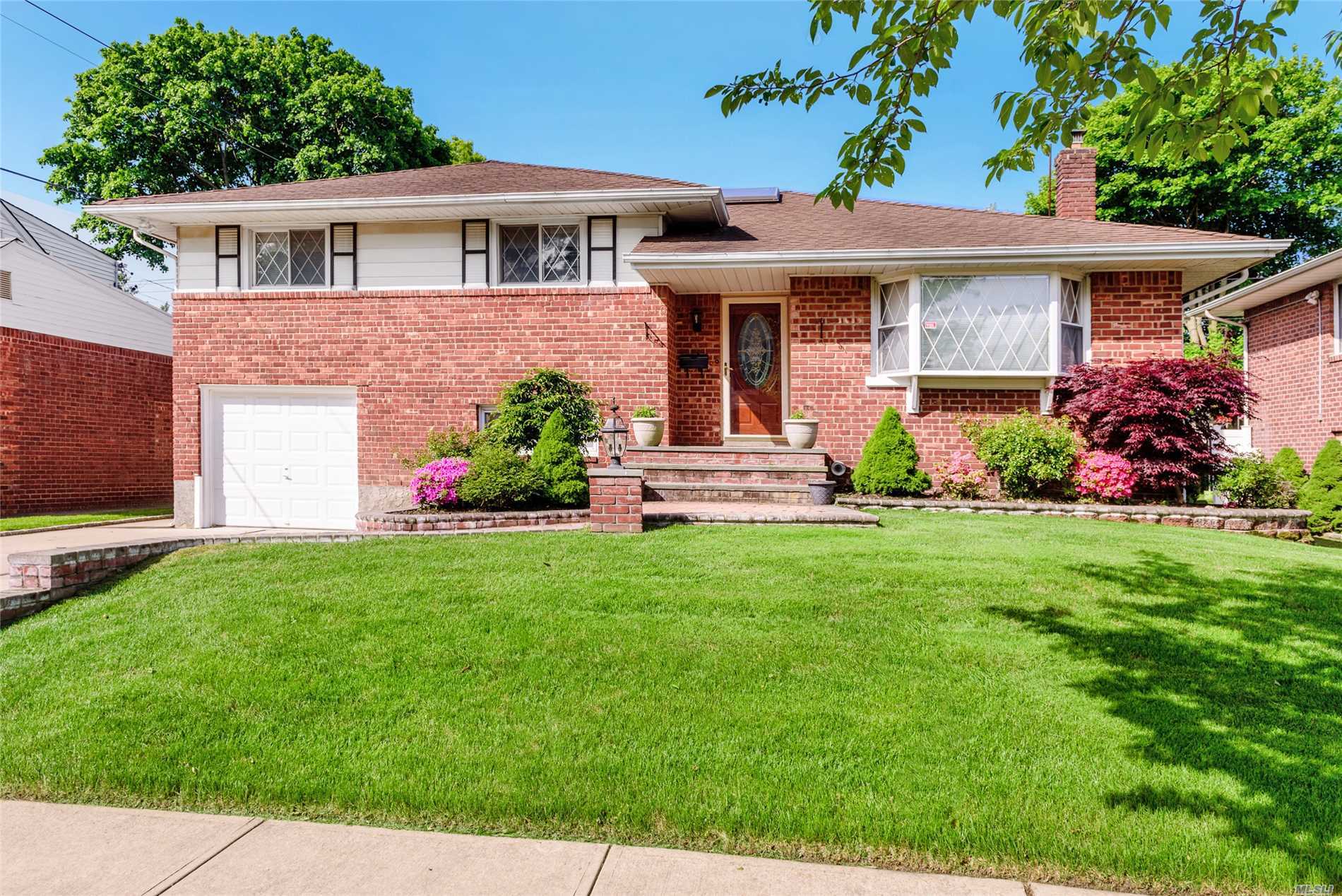 This Spacious Renovated Large 4 Level Split Brick Home Features 4 Bedrooms and 3 Baths, Marble Entry Foyer, Updated Kitchen With Gas Cooking, Skylight, New Bath, Cedar Closet, Lovey and Private Backyard, Jericho School, New To The Market! Move Right In!