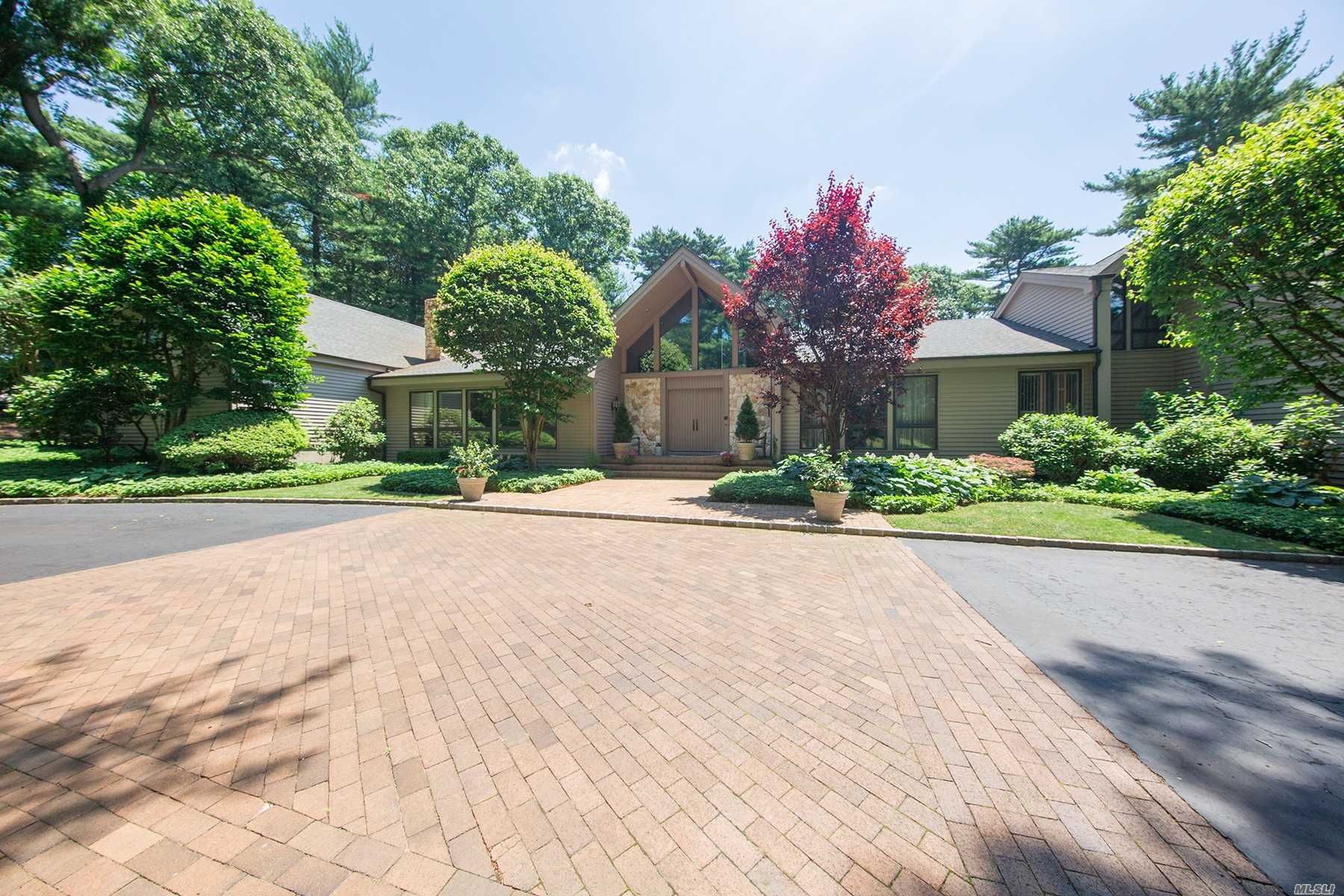 This Elegant Home Features Soaring Ceilings, Custom Millwork, Custom Kitchen And Numerous Windows Allowing The Vast Interior Space To Blend With The Great Outdoors. Built By And For Renowned North Shore Builder Josef Omland With The Finest Materials. Country Club Yard. Complete Privacy. Must See To Believe!