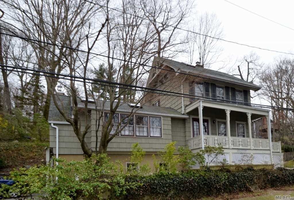 Circa 1868 Sea Cliff Victorian Beautifully Nestled into The Hillside with Waterview. Ef, Fdr, Eik w/Sliders to Wrap Around Deck, Granite Counters and Stainless Appliances, Living Rm w/Wood Burning Fireplace, Full Bath. 2nd Floor; Master Bdrm w/Dressing Rm/Washer/Dryer, Addl Bdrm, Office w/Granny Stairs to Attic. Full Unfinished Basement w/Utilities & Access to Garage.