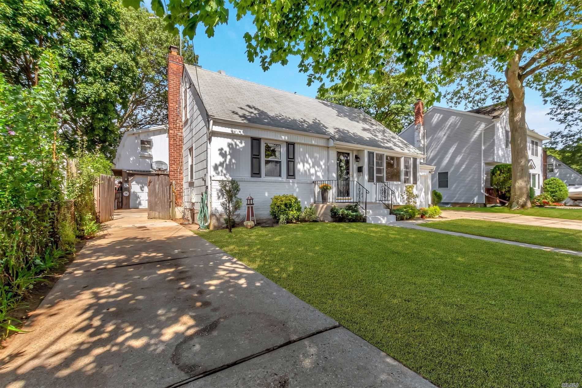 Wonderful 5 bedroom cape in the Village of Massapequa Park. Hardwood floors. Large living spaces. Generous sized bedrooms. Full basement. And a huge detached 2 story garage. Close to restaurants, shops, and LIRR. SD #23 Massapequa.