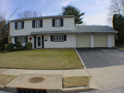 This Colonial Split On Over 1/3 Of An Acre Of Professionally Landscaped Property Features,Updated Eik And Bths,New Arch.Roof And Heating,Anderson Windows,Skylights,Vaulted Ceiling,Multi Car Driveway,Hardwood Floors.Taxes Reflect No Exemptions.Major Price Adjustment .Best Buy In Old Bethpage!! 