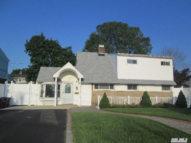 This Cape House Located In Levittown Features 3 Bedrooms,  2 Full Baths,  And A Beautiful Corian Counters In Stainless Steel And Oak Eik With Center Island. A Must See For All!!!