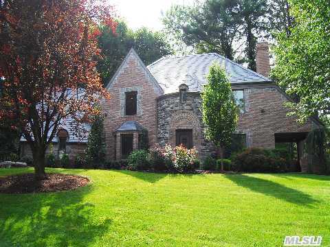 Stunning South Strathmore Tudor. Completely Rebuilt With Old World Charm. Huge Renovated Eik W/Large Center Island. Master Bth W/Fpl. 3/4 Br's & 2.5 Bath. H/W Radiant Floors, Cac. Tumbled Brick & Stone Exterior, New Slate Roof, 2 Outdoor Patios. 2 Car Garage. Outdoor Lighting W/Professional Landscaping. Munsey Park School. Amazing Curb Appeal.