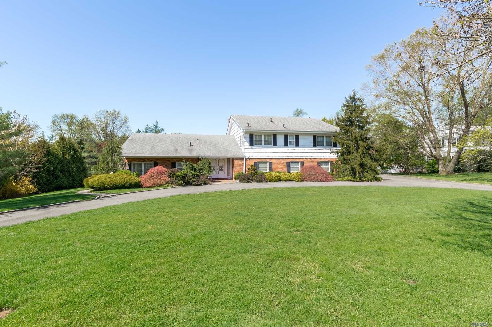 An Elegant Entry Foyer Graces This Stately And Grand Center Hall Colonial. It Is Set On One Lushly Landscaped Acre with a a Circular Driveway and Tennis Court. Large Entertaining Rooms With High Ceilings, Eik, Maid&rsquo;s Rm, 4 Bedrooms And 3.5 Baths. Full Basement, 2 Car Garage and Generator.