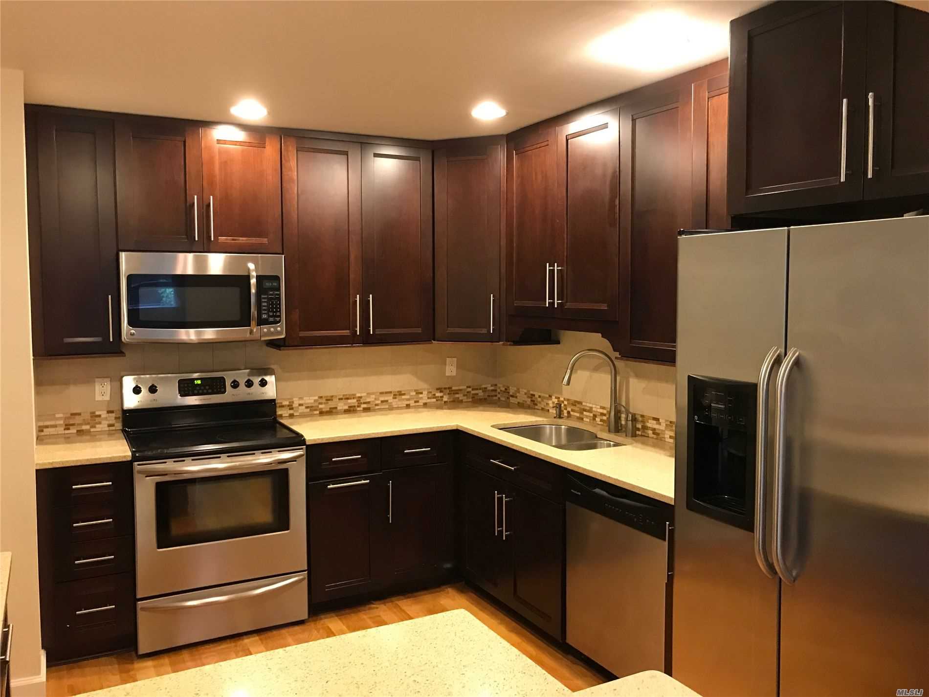 Sunny and Spacious 1 Bedroom Apartment in Bayside Features Living Room, 1 Full Bath, An Eat-In-Kitchen with Stainless Steel Appliances and Granite Counter Tops, Lots of Cabinet Space, Hardwood, Tile and Carpeting. Ample Street Parking. Close To All.