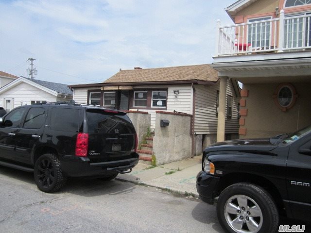 Damaged By Sandy This Home Offers Much Potential.  Either Make It Your Family Project And Re-Do Or Knock Down And Start Over.