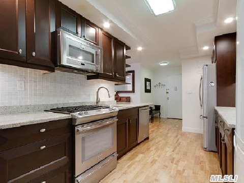 All Binders Off! Top Of The Line Showplace! Beautiful Open Floor Plan. Georgeous Hardwood Floors,  Crown Moldings,  New Kitchen With Granite Countertops,  New Bathrooms, Corner Apt,  Balcony Faces Quiet Garden. Apt. On The 2nd Fl,  Can Convert Back To 3 Bedroom. Night Security. Close To All.