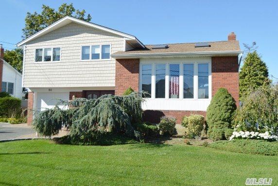 You'll Love This Beautiful Well-Maintained Split-Level Home Located In South Massapequa, Just Blocks From The Beach. Light And Bright, It Features Cac, Family Room, 4 Br, 2.5 Bathes, Skylit Flr, Fdr, Master W/Full Bath, Updated Large Eik With Pella Sliders Overlooking Country Club Backyard With Paver Patio And Plenty Of Grass To Play Around! Don't Miss This One!