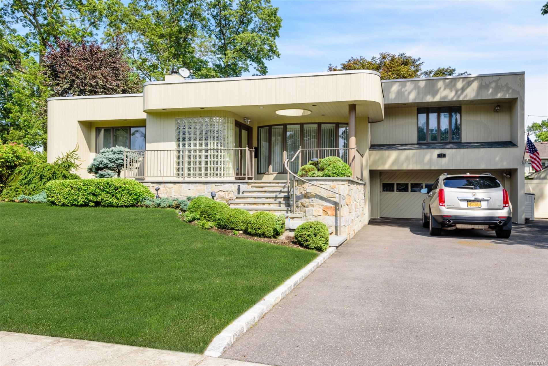 Roslyn Heights. Wonderful 3 bedroom home with 3 full baths, formal living room with high ceilings, formal dining room with built ins, extended den with walls of glass and finished basement. Best part is fabulous backyard with spa like in ground heated pool and cabana and Bath