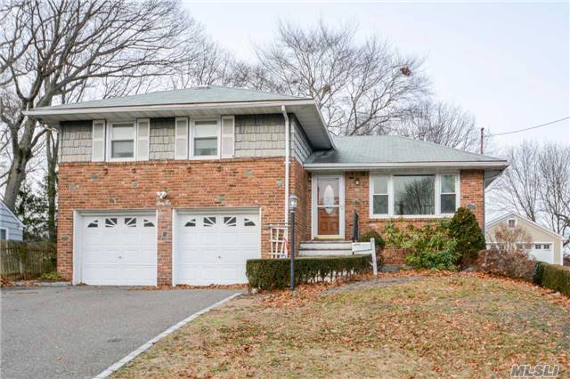 Sprawling 4 Level Split Featuring 2 Car Garage , Wood Floors, Updated Windows, Water Heater, Electric And Gas Boiler. Hurry Must See!!!