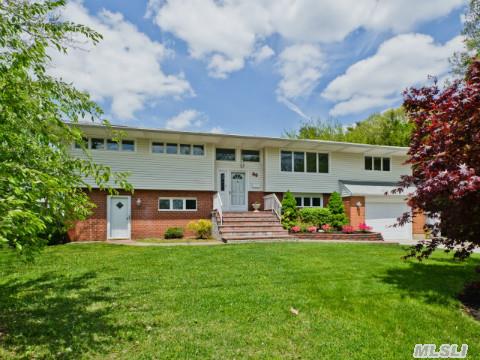 Extra Wide Hi Ranch Located In The Bethpage Estate Section!  This Unique,  Large Home Boasts Gleaming Hw Flrs,  Anderson Windows, Cac, Inground Sprinklers,   Freshly Painted.  Att O'sized Gar W/Ent To House.  Bonus Fam Rms On Both Levels! Tons Of Storage,  Pvc Fenced Yard And 4 Car D'way.  Close To Hs,  Ms,   Park/Pool/Skating Rink, Train,  Hwy 135,  & Shopping! Prof L'scaped.