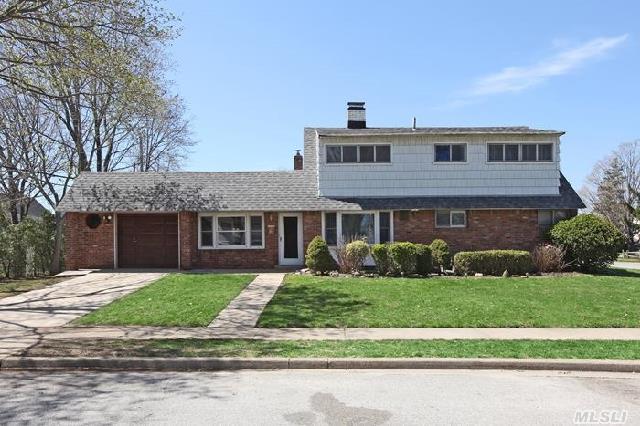 Beautifully Maintained  Expanded Large Colonial 4Br,  2 Bath,  1.5 Car Garage,  Lg Lr W/Fp,  Dr,  Den,  Approx 1973 Sf  Of Open Floor Plan,  All Large Rooms,  Mbr W/Lg Wic,  Update: 2 New Full Baths,  New Hw Floor,  Carpet,  Crown Molding,  Hi-Hats Energy Efficient Led Lights,  Slider From Den,  Appliances,  Front Loader Washer-Dryer,  Boiler,  & More,  Close To Major Hwys,  Shopping,  Train..