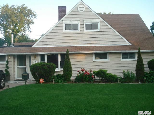 Magnificent Spacious Expanded Ranch. This Home Boasts 4 Or 5 Bdrms W/A Family Rm & Home Office. Completely Updated Custom Kitchen & Baths W/Granite Countertops,  H/W & Tile Flrs On The 1st Flr,  Fplc & Custom Cambridge Pavers On Double Driveway & Patio. Lovely Backyd W/Pvc Fence. Quiet Mid Blk & Conveniently Located Near Shops,  Restaurants & Lirr. Trulya Must See! Low Taxes!