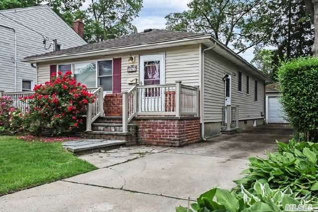 This Adorable Massapequa Ranch Awaits You!  Situated On A Sidewalk-Lined Street This Home Features A Detached 1.5 Car Garage,  Vinyl Siding,  Front Porch,  Full Basement,  Hardwood Under Carpets,  Updated Kitchen,  Inground Sprinklers & More. With Plainedge Schools & Easy Access To Area Shopping,  Highways & The Lirr,  You Will Quickly Fall In Love With All This Home Has To Offer.