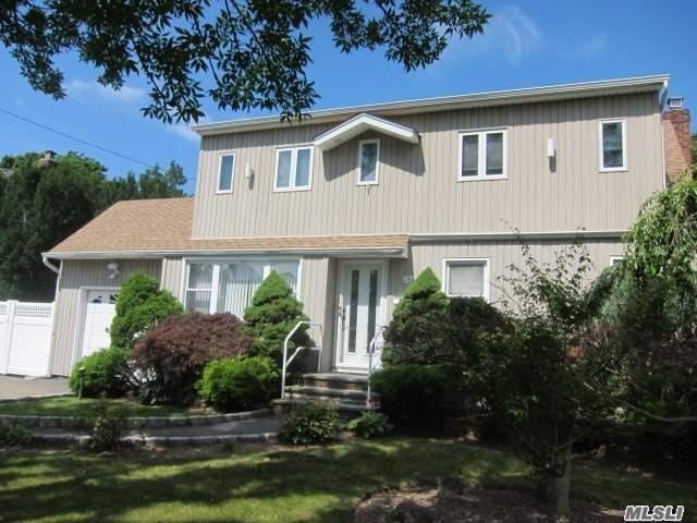 Super Colonial Sd# 23 With Updated Kitchen W/Granite Counters And Updated Baths. Hardwood Floors, Deck, Fenced Backyard. Home Located In Massapequa, No Village Tax, Massapequa Park Post Office. Great Location, Close To Parks, Shopping, And Restaurants. Start Your New Year In A New Home!