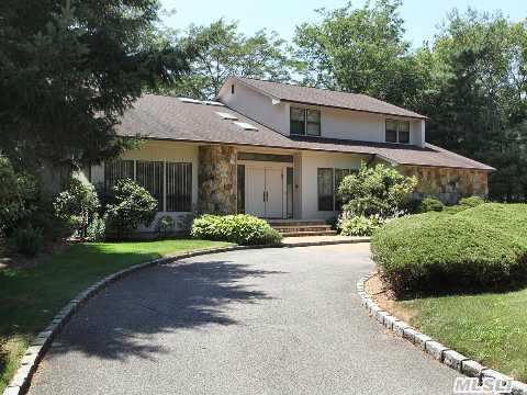 Beautiful Immaculate 5 Bedroom,  3.5 Bath Home In Perfect,  Quiet Cul De Sac Location! Amazing Flat 1 Acre Park Like Property,  Low Taxes For 1 Acre Property In Woodbury! Vaulted Ceilings! Shows Light & Bright! Stone Fireplace In Family Room That Opens To Eat In Kitchen.  Full Basement. New Roof,  Hot Water Heater & Alarm System. Syosset Schools!