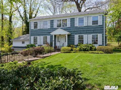 Move Right In To This True Center Hall Colonial Featuring Spacious Rooms,  Beautiful Hardwood Floors,  Five Bedrooms,  31/2 Baths,  Eat In Kitchen With Granite Counter Tops & Sliding Doors Out To Wood Deck , Den With Gas Fireplace And Doors To The Deck,  Formal Dining Room ,  New Roof,  New Heating And Cac , Gorgeous Treed Property In The Beautiful Village Of Roslyn Estates.