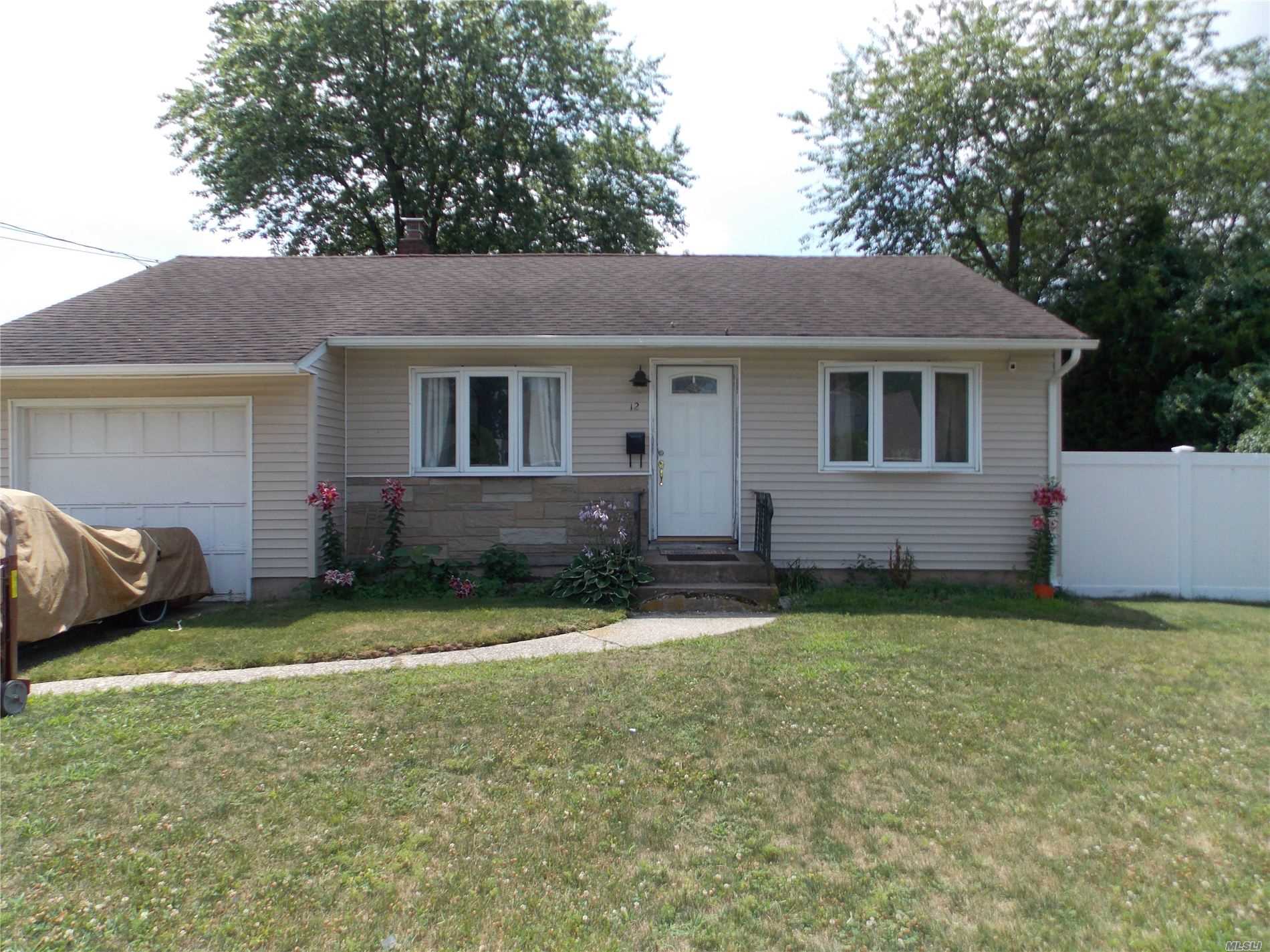 Wideline Ranch located South of Sunrise. Hardwood Floors throughout. Updated Eat-in Kitchen with Sliders to Sunny Southern Exposure Deck and Fully Fenced Yard. Lots Of Natural Light All Throughout The House. Updated Bath with Shower Stall. Easy to Convert Garage for Extra Living Space. Full Unfinished Basement, Top Of The Line Heating System.