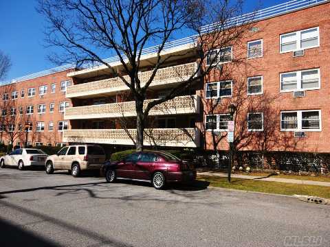 Picture Perfect! Oversized, In Excess Of 1200 Square Feet. Features Include Split Bedrooms, Glistening Hardwood Floors, Sunny Southern Exposure 30' Terrace & Hi-Hat Lighting. This Unit Is Magnificently Renovated- Gorgeous Kitchen W/ Granite Countertops & Tile Backsplash, 2 Full Baths W/ Decorator Finishes. Garage Parking & Personal Storage. Close To Parks, Shopping & Lirr.