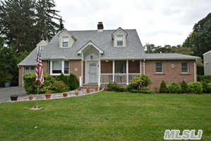 Beautiful Updated Expanded Cape On Mid-Block Location In Desirable Manhasset Bay Estates. Beach And Mooring Rights With Association Fee.